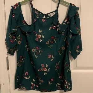 Cold shoulder 3/4 sleeve top. Never worn.